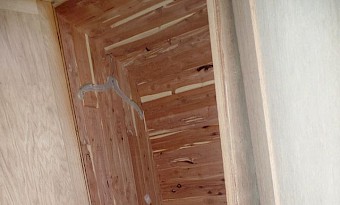 Inside the bus, the back bulkhead has hanging lockers, port and starboard.